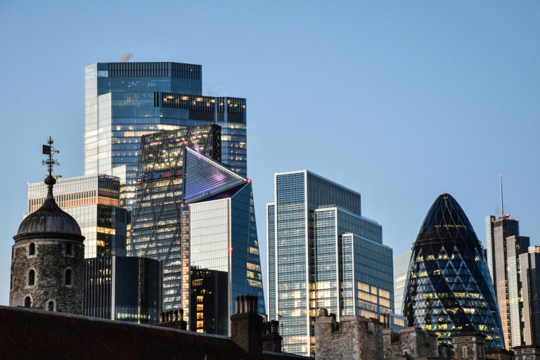 Modern skyscrapers and architectural landmarks against a clear blue sky.